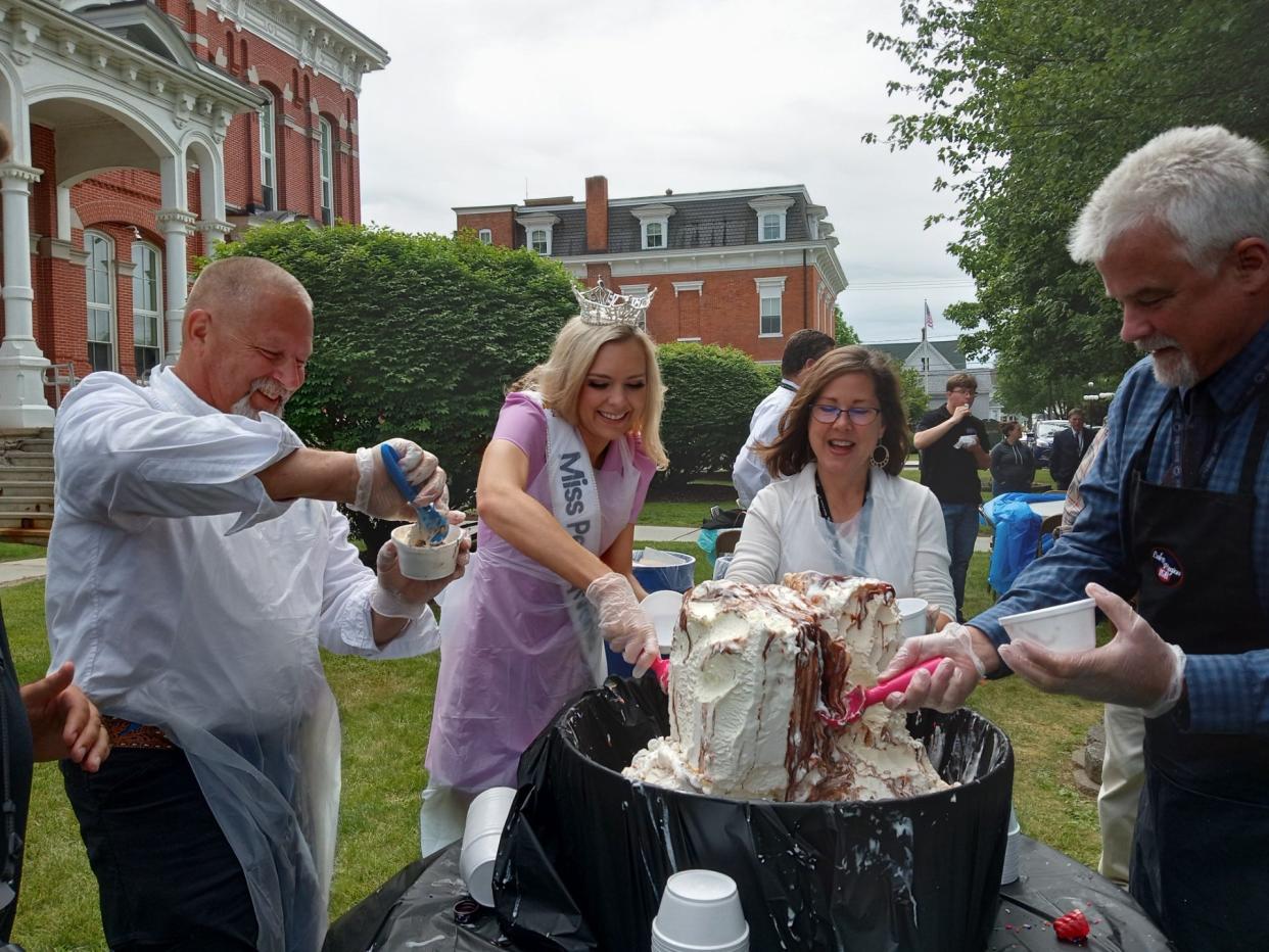 Helping the Wayne County Dairy Court make ice cream sundaes on the courthouse lawn, June 21, were from left Commissioner Brian Smith, Miss Pennsylvania Miranda Moore and commissioners Joceyln Cramer and James Shook. Free sundaes were given out to the public who came by as well as county employees.