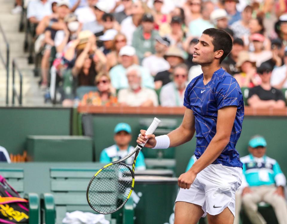 Carlos Alcaraz of Spain reacts to a point lost to Rafael Nadal of Spain during their ATP semifinal match of the BNP Paribas Open at the Indian Wells Tennis Garden in Indian Wells, Calif., Saturday, March 19, 2022. 