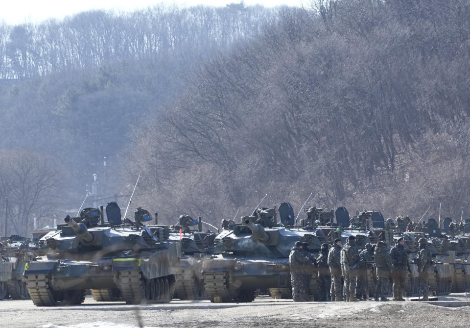 South Korean army soldiers gather next to their armored vehicles during a military exercise in Paju, South Korea, near the border with North Korea, Wednesday, Jan. 24, 2024. South Korea's military says North Korea fired several cruise missiles into waters off its western coast, adding to a provocative run of weapons demonstrations in the face of deepening nuclear tensions with the United States, South Korea and Japan. (AP Photo/Ahn Young-joon)
