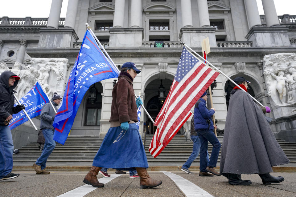 HARRISBURG, PA - DECEMBER 14: Trump supporters pray and sing during a Jericho March outside the State Capitol in Harrisburg, Pennsylvania on December 14, 2020. A small group circled the Capitol during the Electoral College vote. (Photo by Bonnie Jo Mount/The Washington Post via Getty Images)