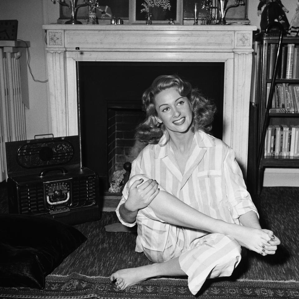 French actress Martine Carol at home in pajamas, undated.&nbsp;