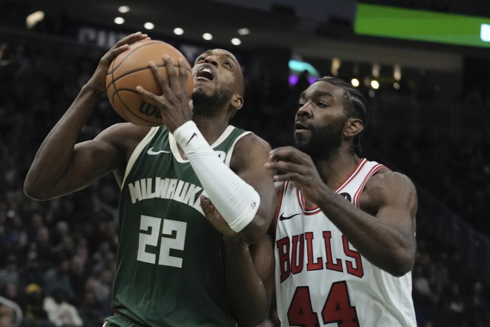 Milwaukee Bucks' Khris Middleton shoots past Chicago Bulls' Patrick Williams during the first half of an NBA basketball game Monday, Dec. 11, 2023, in Milwaukee. (AP Photo/Morry Gash)