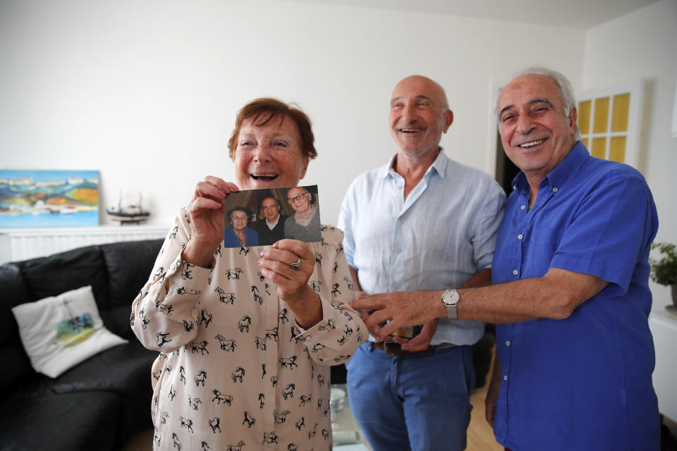 In this photo taken on Friday June 5, 2020, Monette Hayoun, Dr Robert Haiun, and Gilbert Haiun, from left, pose during an interview in Ivry sur Seine, south of Paris. Families whose elders died behind the closed doors of homes in lockdown are filing wrongful death lawsuits, triggering police investigations. One suit focuses on the death of Meyer Haiun a severely disabled 85-year-old in a Paris home managed by a Jewish charitable foundation headed Eric de Rothschild, scion of Europe's most famous banking dynasty. (AP Photo/Francois Mori)