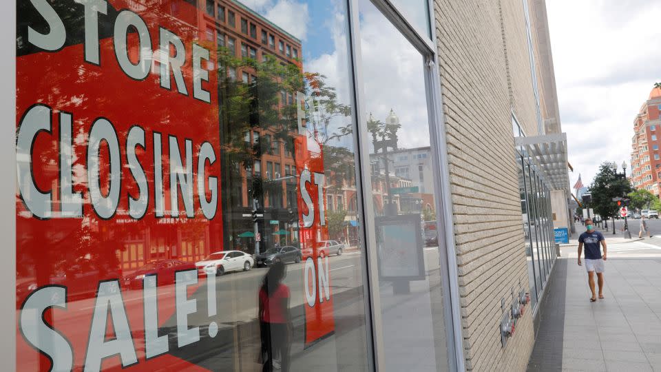 A sign in the windows of Lord & Taylor, advertising a store closing sale, in 2020. - Brian Snyder/Reuters