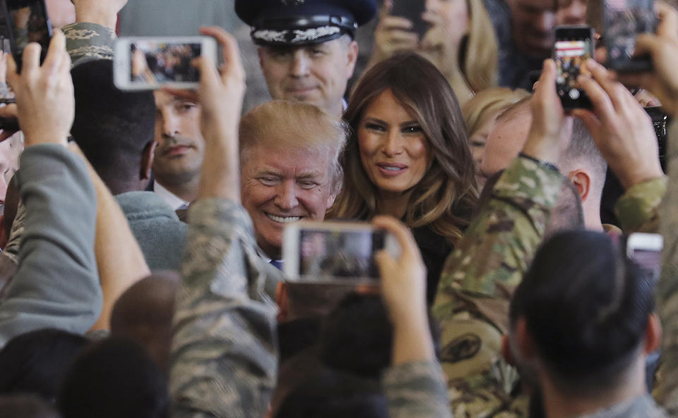 <p>President Donald Trump and First Lady Melania Trump are surrounded by the U.S. military personnel upon his arrival at the U.S. Yokota Air Base on the outskirts of Tokyo, Sunday, Nov. 5, 2017. President Trump praised Japan as “a treasured partner” and “crucial ally” as he kicked off a grueling and consequential first trip to Asia. Trump landed at Yokota Air Base where he was greeted by cheers from gathered servicemembers. (Photo: Eugene Hoshiko/AP) </p>