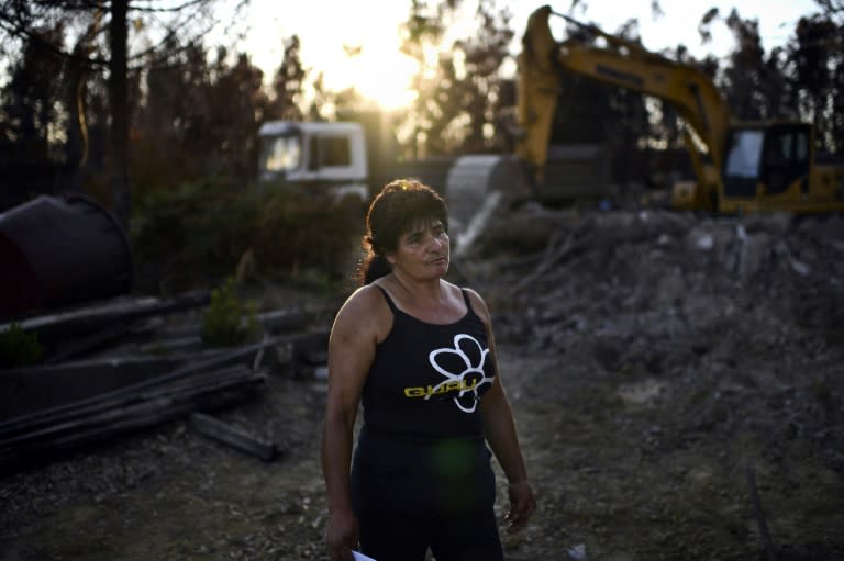 "We lost everything," said Edite Godinho, watching a bulldozer demolish the charred remains of her home in Vale da Nogueira, Portugal