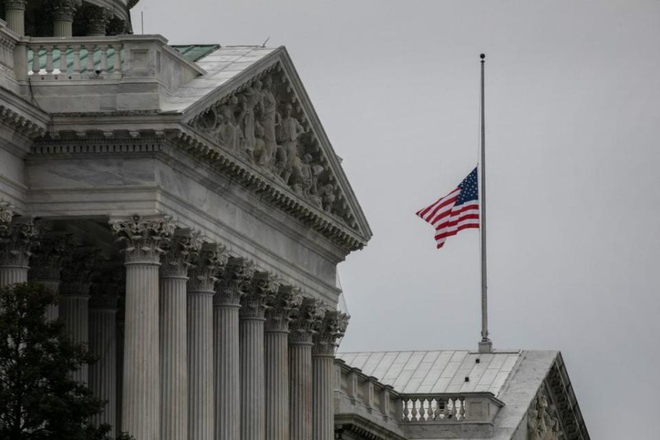 The American flag flies at half-staff at the U.S. Capitol on January 08, 2021 in Washington, DC. House Speaker Nancy Pelosi ordered the building’s flags be flown at half-staff in honor of Capitol Police Officer Brian Sicknick, 42, who died after being injured during clashes with a pro-Trump mob at the Capitol on Wednesday. Sicknick, a military veteran, was a 12-year member of the force. (Photo by John Moore/Getty Images)