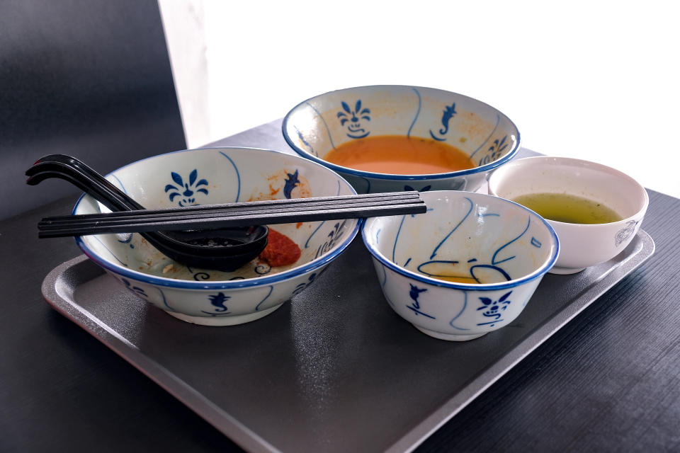 Tray of used crockery on table. Diners at coffee shops, food courts, hawker centres are expected to clear their tables, dirty trays and litter to designated sorting station