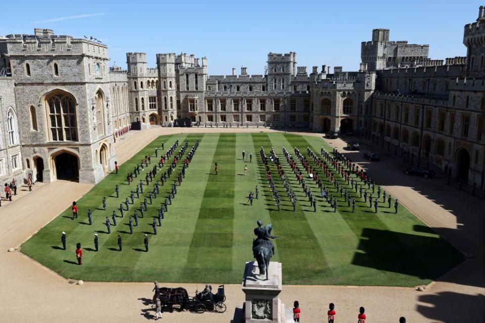 <p>Members of the military assembled on the Windsor Castle grounds, awaiting the processional. </p>