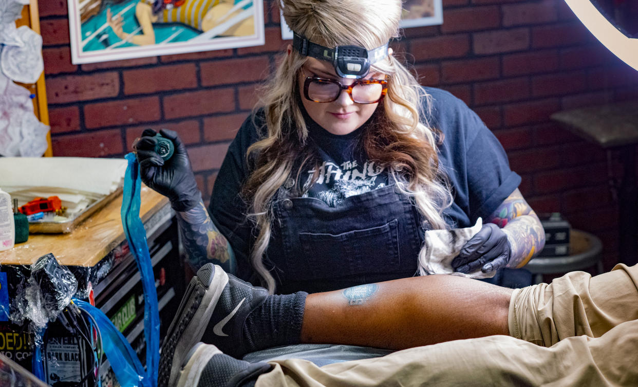 A Bad Apple Tattoo artist inking a Subway super fan. (Subway)