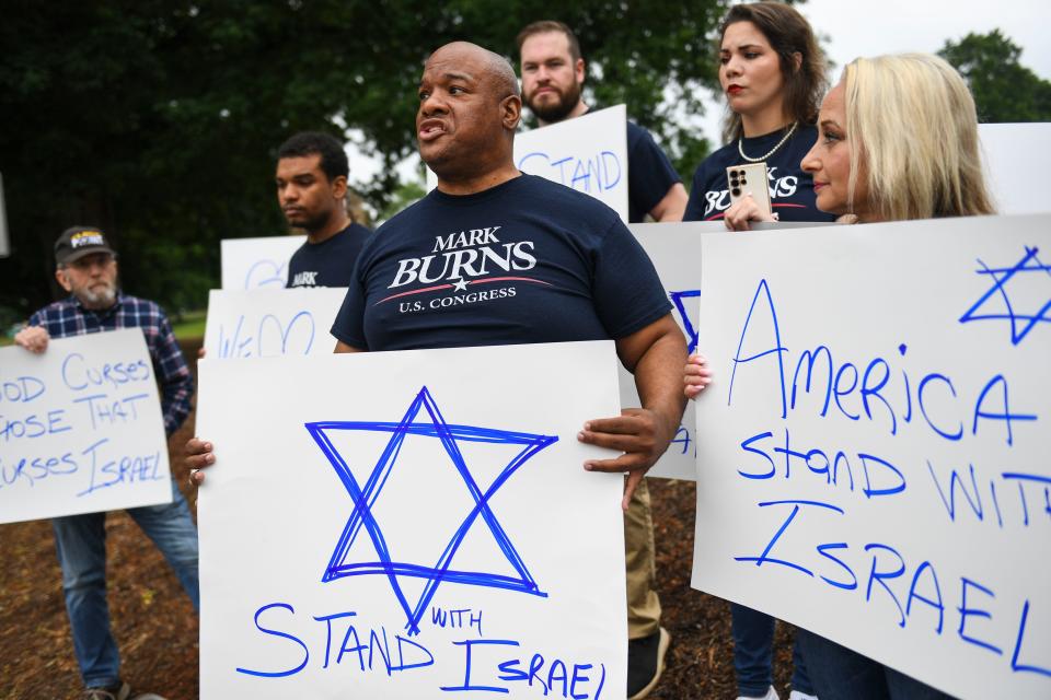 Pastor Mark Burns, a Donald Trump endorsed congressional candidate for South Carolina District 3, which includes Clemson, and counter-protester, speaks to the media during a student protest in support of Palestinians outside of Sikes Hall at Clemson University on Saturday, May 4, 2024.