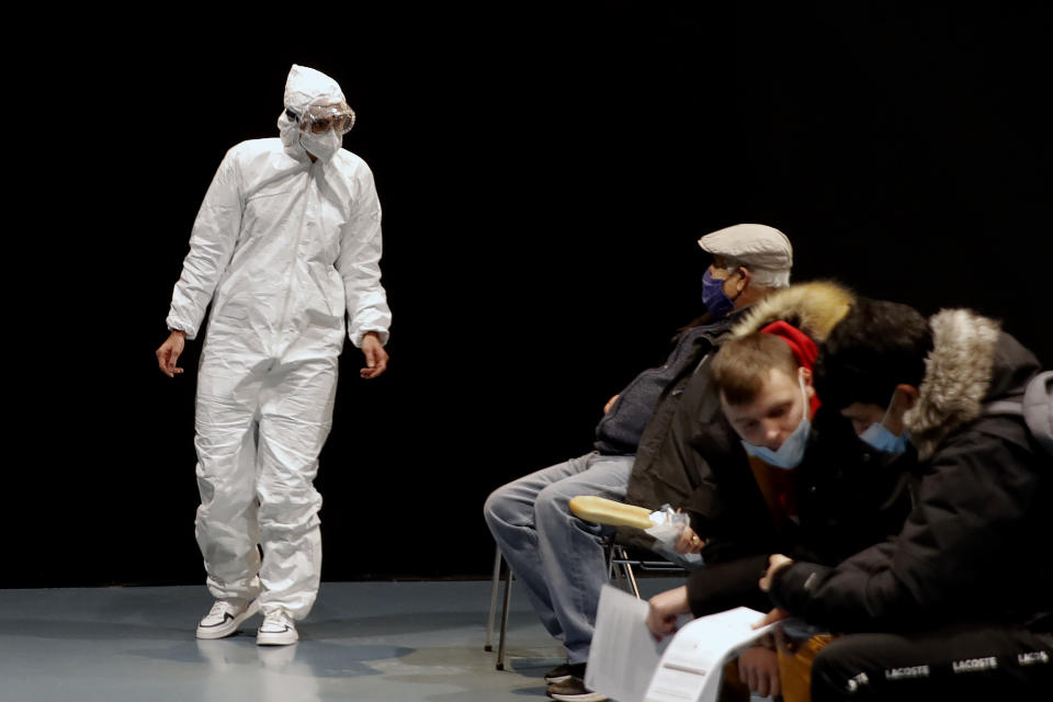 Local residents wait to be tested for Covid-19 at a mass testing center in Bagneux, outside Paris, France, Monday, Jan.11, 2021. Authorities are launching a weeklong mass testing program to assess the rate of Covid-19 infections and assess the spread of the Kent variant, a highly contagious coronavirus strain that first appeared in southern England in November. (AP Photo/Christophe Ena)