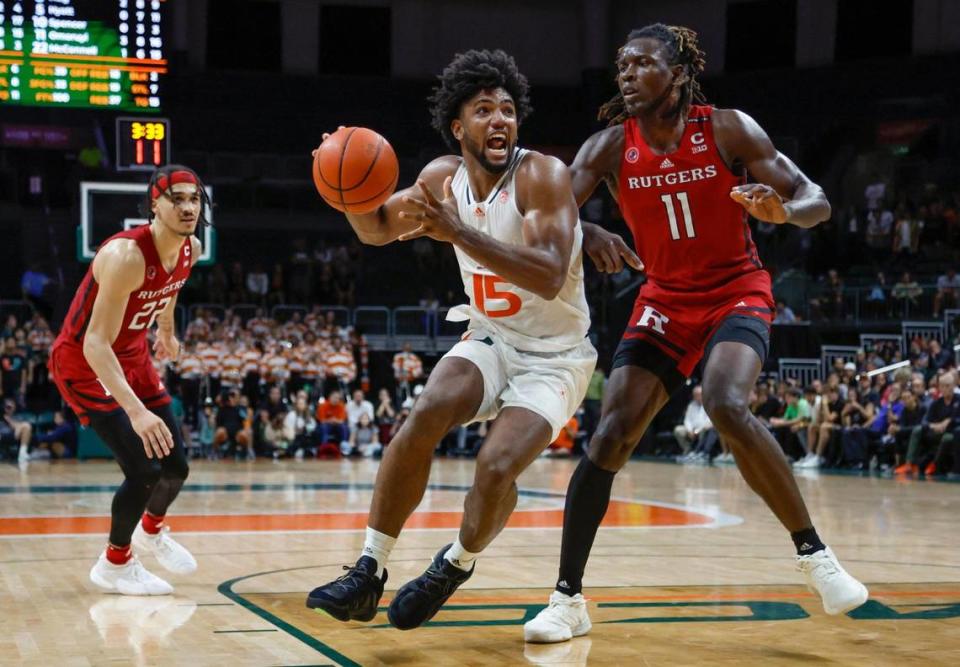 Miami Hurricanes forward Norchad Omier (15) drives to the basket as Rutgers Scarlet Knights center Clifford Omoruyi (11) defends in the second half at the Watsco Center in Coral Gables on Wednesday, November 30, 2022.