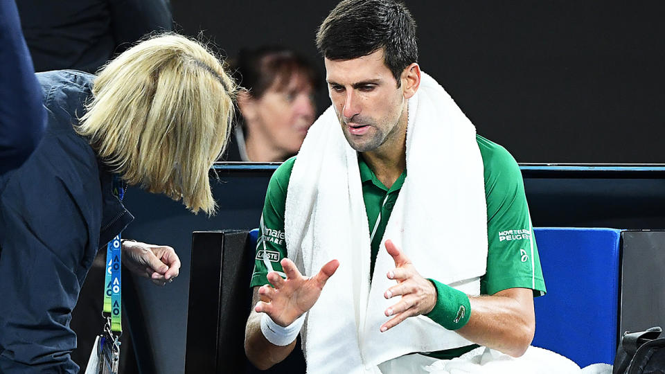 Novak Djokovic, pictured here receiving treatment during the Australian Open final.
