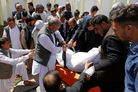 People attend the burial ceremony for the victims of Friday's attack at a Shi'ite Muslim mosque in Kabul, Afghanistan August 26, 2017. REUTERS/Mohammad Ismail