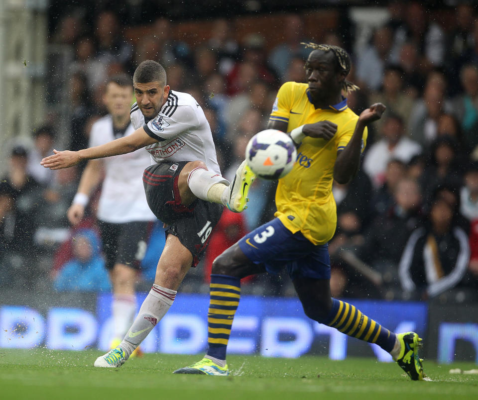 Arsenal's Bacary Sagna tries to block a shot by Fulham's Adel Taarabt during the Barclays Premier League match at Craven Cottage, London.