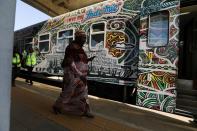 A passenger walks towards the train as Abuja-Kaduna train services resumes after an attack as Abuja-Kaduna train services resumes after an attack on its passengers, in Abuja