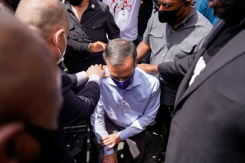 LOS ANGELES, CA - JUNE 02: LA Mayor Eric Garcetti walks out to address protesters and clergy members from the Los Angeles area that are participating in a march and peaceful protest in downtown Los Angeles outside of LA City Hall and LAPD Headquarters on Tuesday, June 2, 2020 in Los Angeles, CA. Protests erupted across the country, with people outraged over the death of George Floyd, a black man killed after a white Minneapolis police officer pinned him to the ground with his knee. (Kent Nishimura / Los Angeles Times)