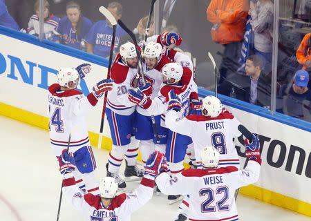 May 22, 2014; New York, NY, USA; Montreal Canadiens center Alex Galchenyuk (27) celebrates with his teammates after scoring the game-winning goal against the New York Rangers during the overtime period in game three of the Eastern Conference Final of the 2014 Stanley Cup Playoffs at Madison Square Garden. Ed Mulholland-USA TODAY Sports