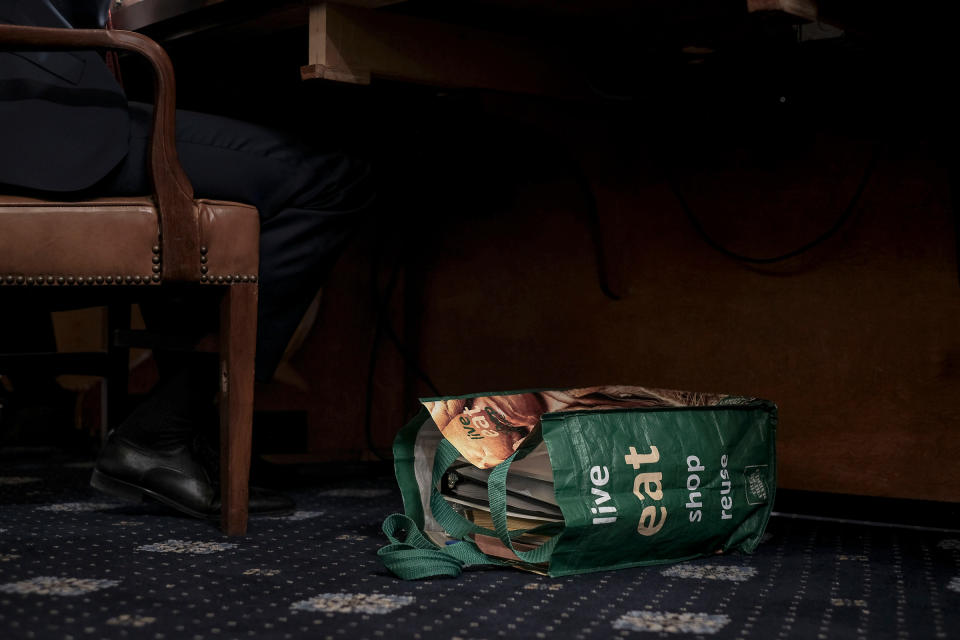 A reusable shopping bag filled with documents and notes sit at the feet of Stephen Castor, the Republican counsel to the Judiciary and Intelligence committee, at the beginning of the House Judiciary Committee hearing on the impeachment inquiry in Washington, D.C., on Dec. 9, 2019. | Gabriella Demczuk for TIME