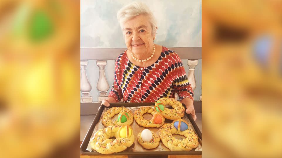 Nonna Romana holds scarcella, a braided Easter bread decorated with colorful hard-boiled eggs. Her granddaughter, Rossella Rago, said Romana made them every Easter for all the kids.  - Rossella Rago