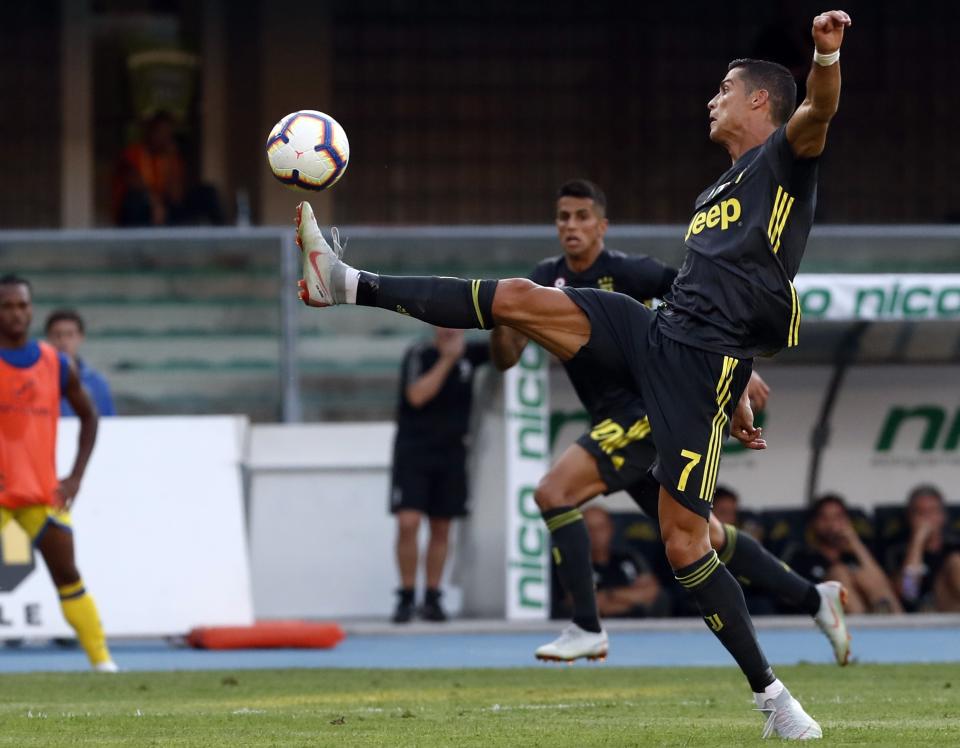 Slow start: Juventus’ Ronaldo reaches for the ball during the Serie A soccer match between Chievo