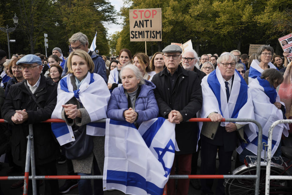 FILE - People listen to speeches during a demonstration against antisemitism and to show solidarity with Israel in Berlin, Germany, on Oct. 22, 2023. More than 250 Holocaust survivors have joined an international initiative to share their stories of loss and survival with students around the world during a time of rising antisemitism following the Oct. 7 Hamas attack on Israel that triggered the war in the Gaza Strip. The Survivor Speakers Bureau was launched Thursday by the New York-based Conference on Jewish Material Claims Against Germany, also referred to as the Claims Conference. (AP Photo/Markus Schreiber, File)