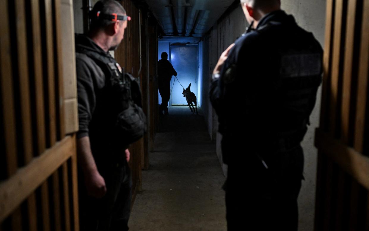 Police check a building in Chenove, central eastern France, as part of the anti-drugs 'XXL clean-up operation'