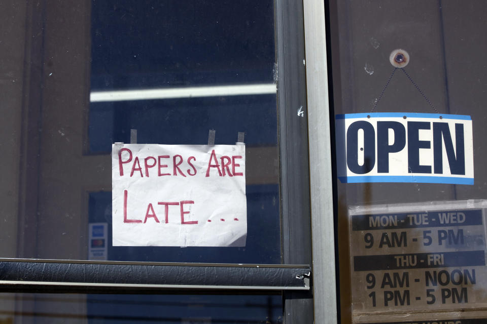 A handmade sign on a door of the Marion County Record announces that the newspaper's latest weekly edition will be late, Wednesday, Aug. 16, 2023, in Marion, Kan. The newspaper was hours late in delivering its edition to the printing press because a raid of its offices and the publisher's home on Aug. 11, 2023, led to the seizure of computers and personal cell phones. (AP Photo/John Hanna)