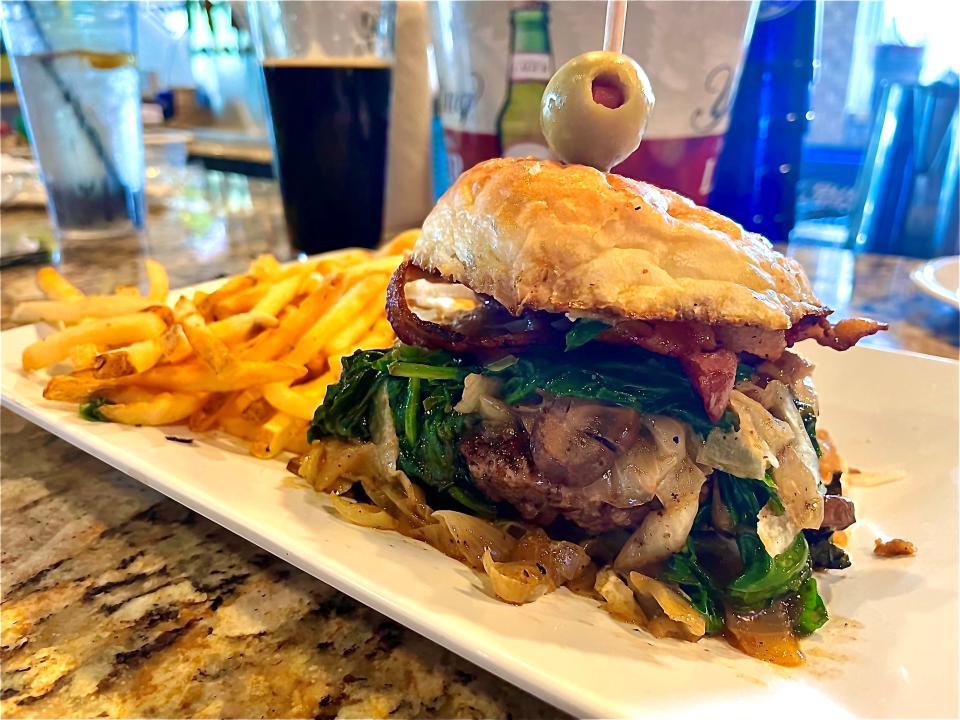 The Wine"oh" burger from Fat Katz features house-ground beef, cabernet-infused mushrooms, Manchego, bacon, caramelized onions, spinach and garlic aioli on a house-made bun.