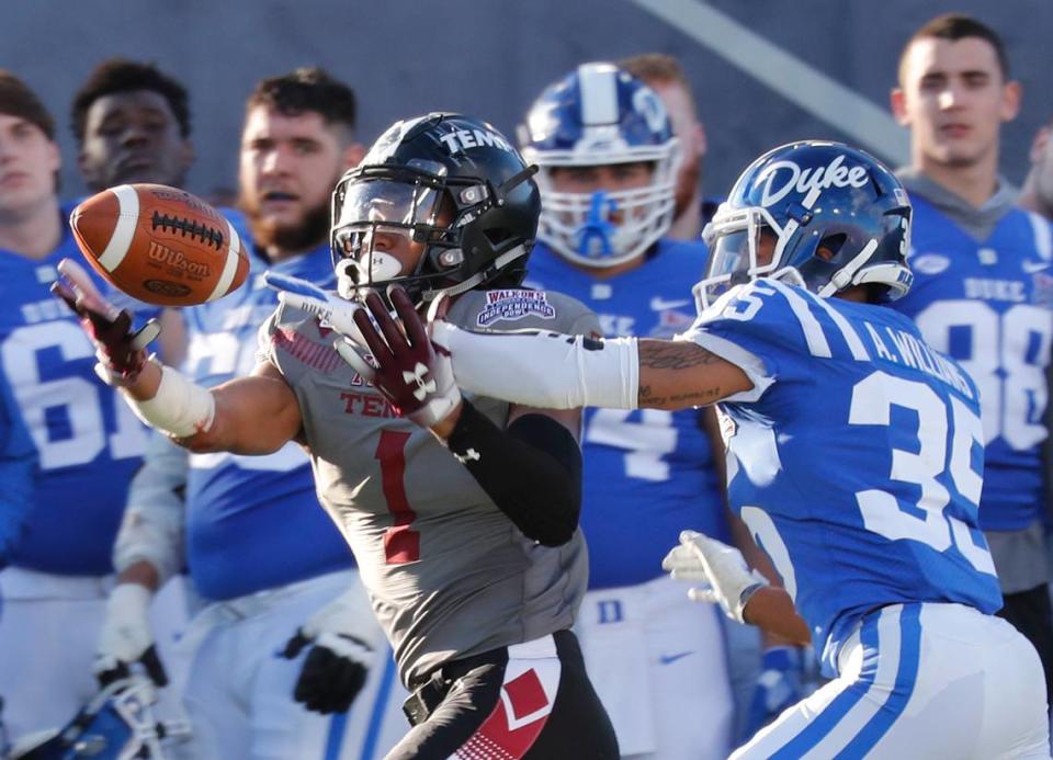 Former Temple wide receiver Ventell Bryant (1) bobbles a pass as Duke cornerback Antone Williams (35) closes in during the second half of the Independence Bowl in Shreveport, La., Thursday, Dec. 27, 2018. Duke won 56-27.