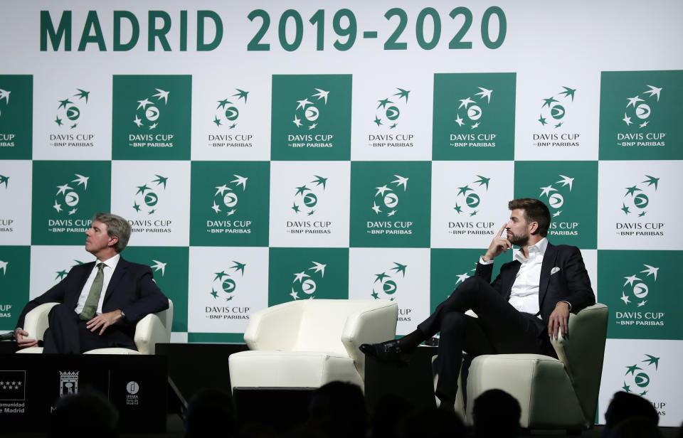 FC Barcelona soccer player and founder of investment group Kosmos, Gerard Pique, right, attends the presentation of the city of Madrid as hosts of the new Davis Cup for the next two years in Madrid, Spain, Wednesday, Oct. 17, 2018. (AP Photo/Manu Fernandez)