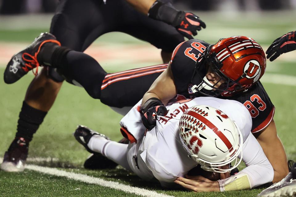 Nov 12, 2022; Salt Lake City, Utah, USA; Stanford Cardinal quarterback Tanner McKee (18) is sacked by Utah Utes defensive end Jonah Elliss (83) in the second quarter at Rice-Eccles Stadium. Mandatory Credit: Rob Gray-USA TODAY Sports