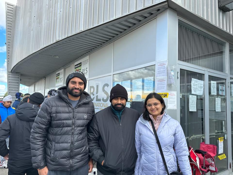 Richard Patel (Centre) and his friends waited for over 10 hours but did not get a chance to apply. They decided to take turns and reserve their spot in the queue until the office reopened the next morning.