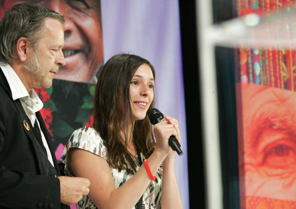 Lille, FRANCE: French singer Renaud and his daughter Lolita Sechan give a speech prior to French Socialist Party (PS) presidential candidate Segolene Royal's meeting, 03 May 2007 in Lille northern France, in the final week of campaigning ahead of the second round of the presidential election.  French right-wing party UMP presidential candidate Nicolas Sarkozy will face Segolene Royal in the presidential election run-off next 06 May.  AFP PHOTO / PHILIPPE HUGUEN (Photo credit should read PHILIPPE HUGUEN/AFP via Getty Images)