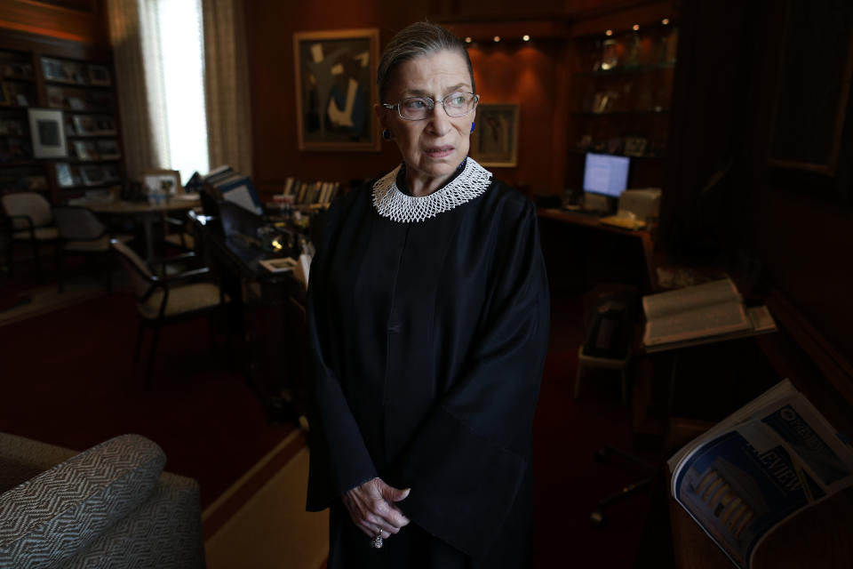 FILE - In this July 24, 2013, file photo, Associate Justice Ruth Bader Ginsburg poses for a photo in her chambers at the Supreme Court in Washington, before an interview with The Associated Press. Ginsburg, 87, developed a cultlike following over her more than 27 years on the bench, especially among young women who appreciated her lifelong, fierce defense of women's rights. She died Sept. 18, 2020. (AP Photo/Charles Dharapak, File)