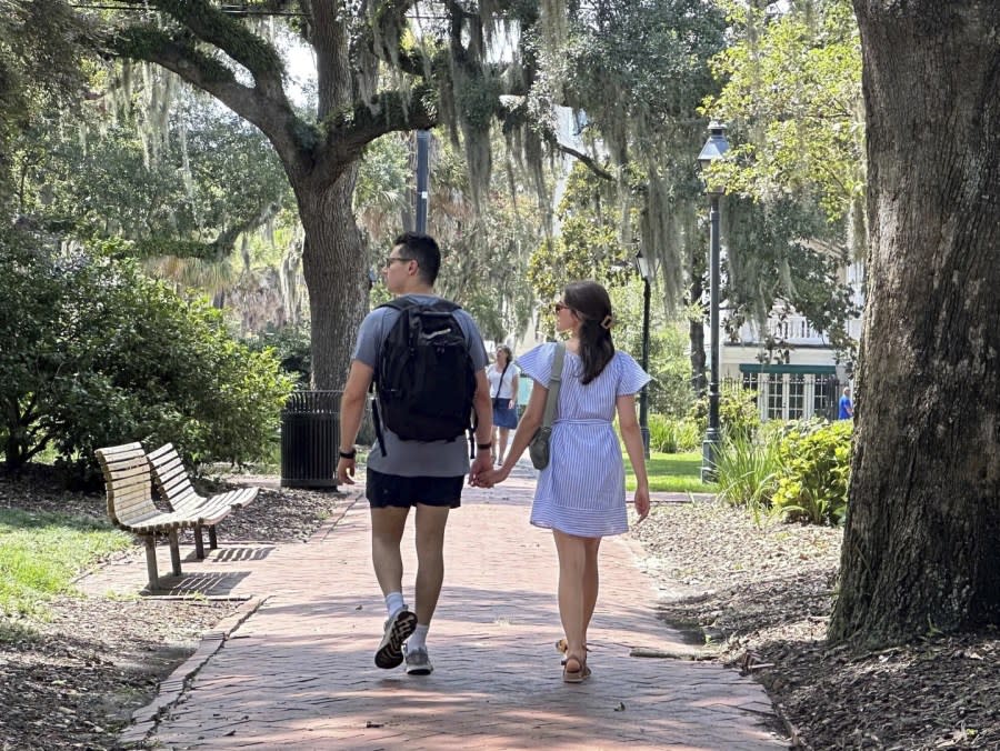 People stroll through the space formerly known as Calhoun Square in Savannah, Ga., on Wednesday, Aug. 9, 2023. (AP Photo/Russ Bynum)