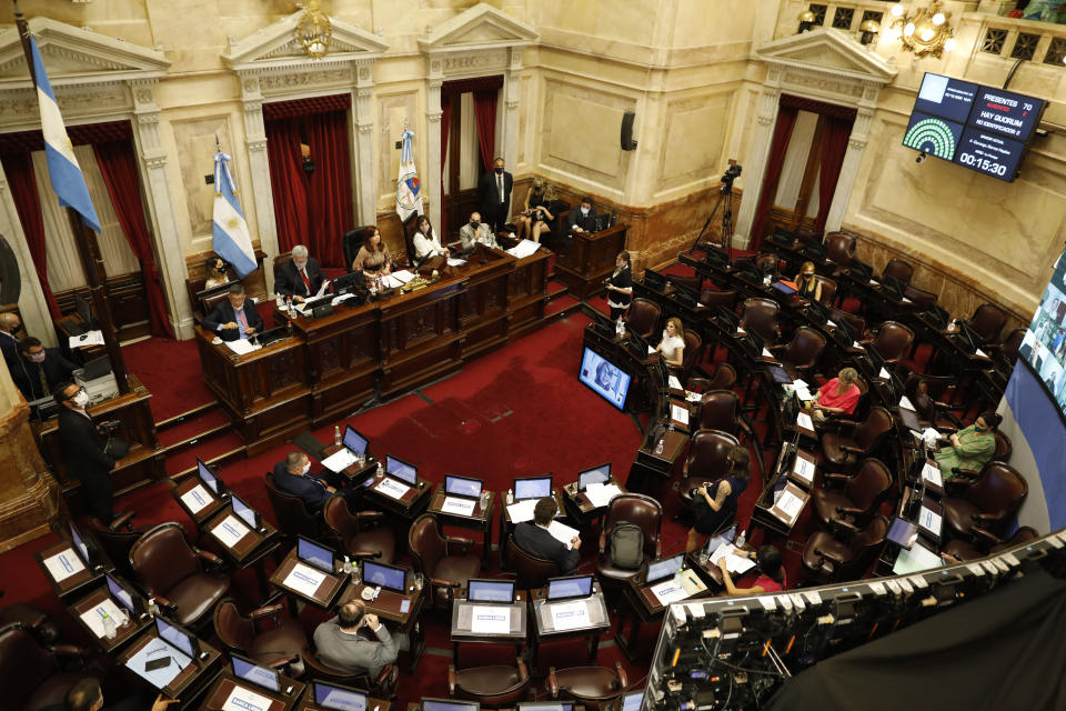 Lawmakers debate a bill that would decriminalize abortion, in Congress in Buenos Aires, Argentina, Tuesday, Dec. 29, 2020. (AP Photo/Natacha Pisarenko)
