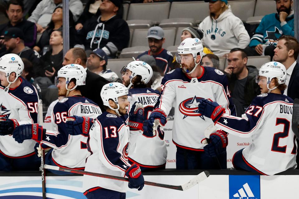Columbus Blue Jackets left wing Johnny Gaudreau (13) celebrates with bench after scoring a goal against the San Jose Sharks in the first period of an NHL hockey game in San Jose, Calif., Tuesday, March 14, 2023. (AP Photo/Josie Lepe)
