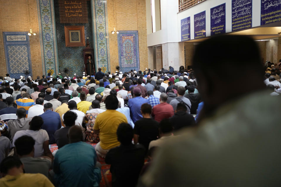 Imam Sheikh David Munir, center, leads worshippers in a prayer for peace at the Central Mosque of Lisbon, in Lisbon, Friday, Oct. 13, 2023. The main mosque of the Portuguese Islamic community was completely full as worshippers gathered for their first Friday prayers since Hamas militants attacked Israel, igniting the latest Israel-Palestinian war. (AP Photo/Armando Franca)