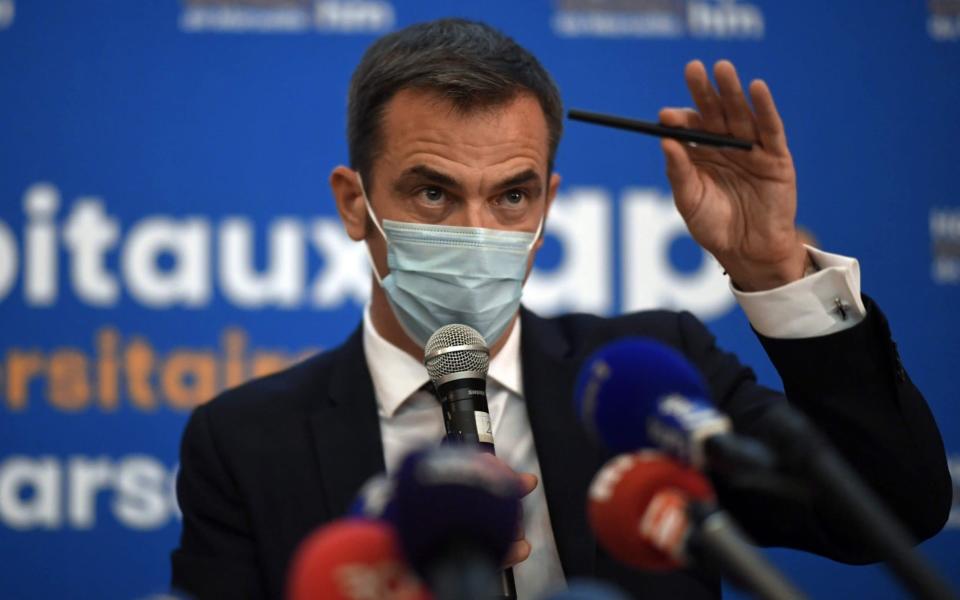 French Health Minister Olivier Veran gives a press conference during a visit at the Covid-19 area of La Timone public hospital, Marseille - CHRISTOPHE SIMON/AFP