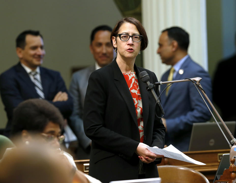 FILE -- In this May 28,2019 file photo Assemblywoman Laura Friedman, D-Glendale, urges lawmaker to approve her measure to ban the manufacture and sale of new fur products, in Sacramento, Calif. California will ban the sale and manufacture of new fur products and bar most animals from circus performances under a pair of bills signed Saturday, Oct. 12, 2019 by Gov. Gavin Newsom. (AP Photo/Rich Pedroncelli, File)