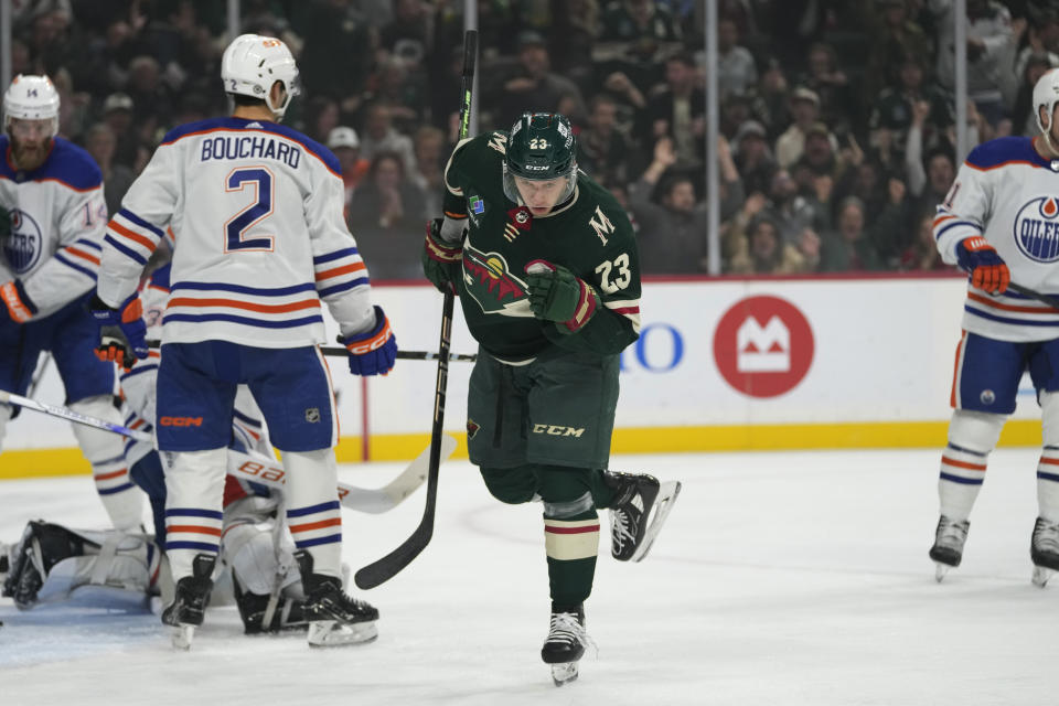 Minnesota Wild center Marco Rossi (23) celebrates after scoring against the Edmonton Oilers during the first period of an NHL hockey game Tuesday, Oct. 24, 2023, in St. Paul, Minn. (AP Photo/Abbie Parr)