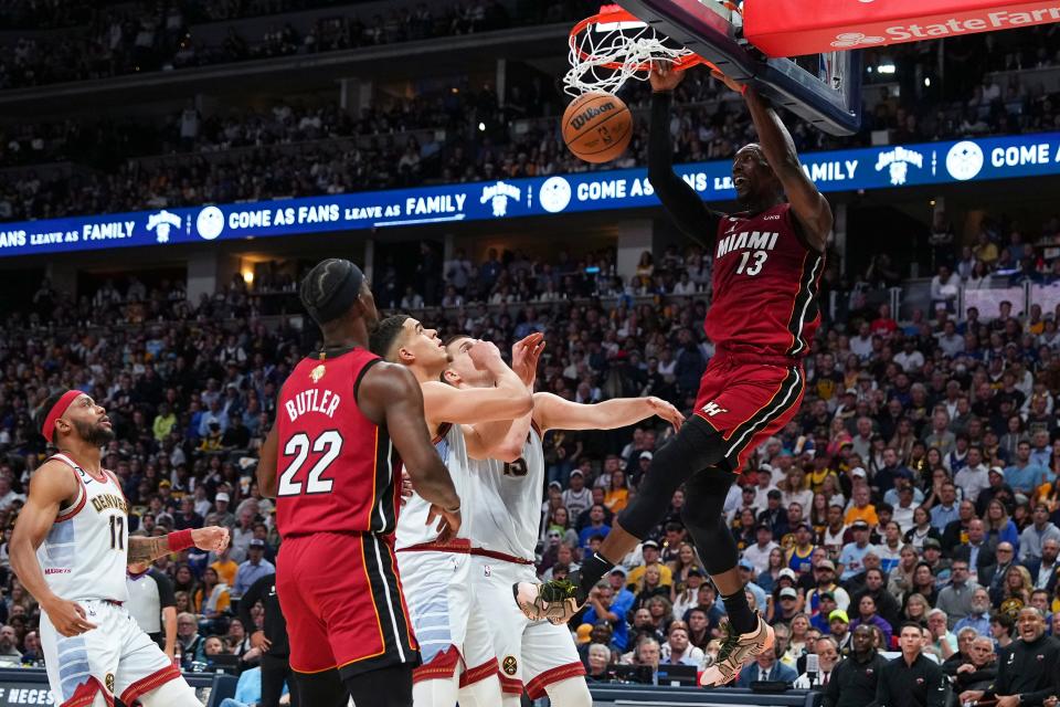 Miami Heat center Bam Adebayo (13) dunks against the Denver Nuggets during the first half of Game 5 of basketball's NBA Finals, Monday, June 12, 2023, in Denver. (AP Photo/Jack Dempsey)