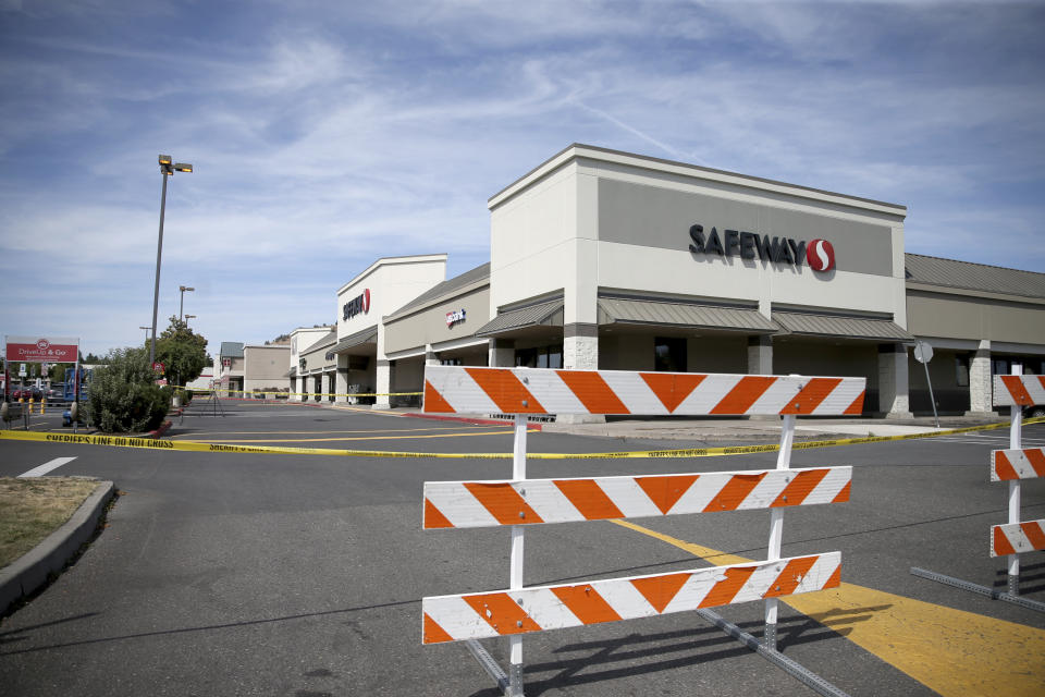 The Forum Shopping Center in Bend, Ore. remained closed Monday, Aug. 29, 2022 as police investigated a shooting at the Safeway there that left two people and the suspected gunman dead Sunday night. (Dave Killen/The Oregonian via AP)