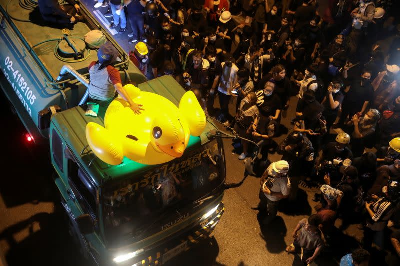 An inflatable duck lies on a truck as demonstrators gather during a rally in Bangkok