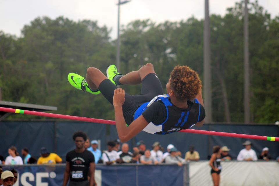 T'Vario Willis of Ridgeview tries to clear the bar in the boys high jump at the state championships.