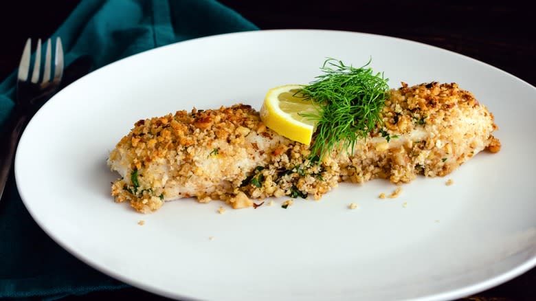 Nut crusted fish on plate