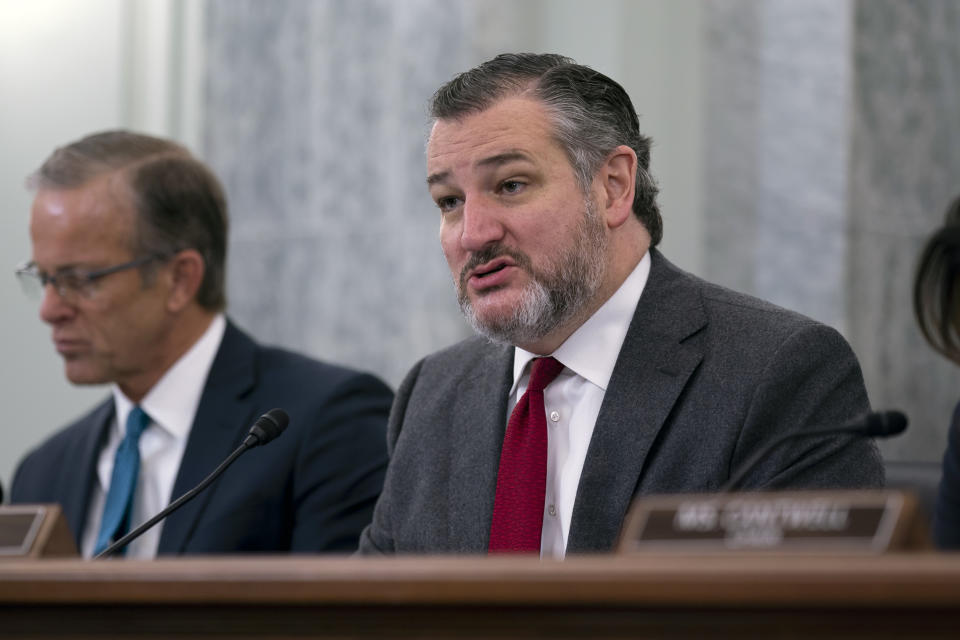 Sen. Ted Cruz, R-Texas, center, the ranking member of the Senate Commerce, Science, and Transportation Committee, is joined at left by Sen. John Thune, R-S.D., left, as he questions Acting Administrator of the Federal Aviation Administration Billy Nolen to examine recent failures in the FAA's NOTAM system, at the Capitol in Washington, Wednesday, Feb. 15, 2023. (AP Photo/J. Scott Applewhite)