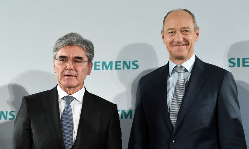 German engineering group Siemens CEO Joe Kaeser and deputy CEO Roland Busch attend a news conference prior to the annual general meeting in Munich